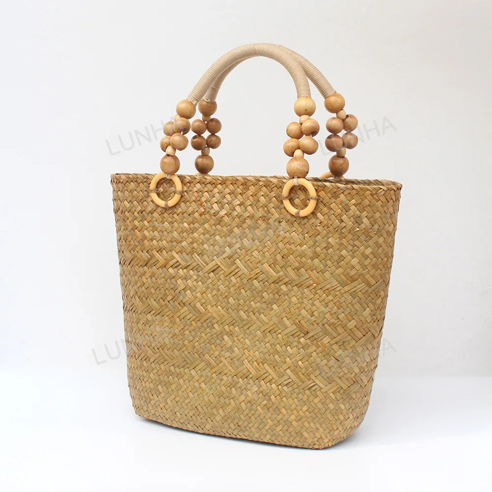 Woven handbag with wooden beads on a white background