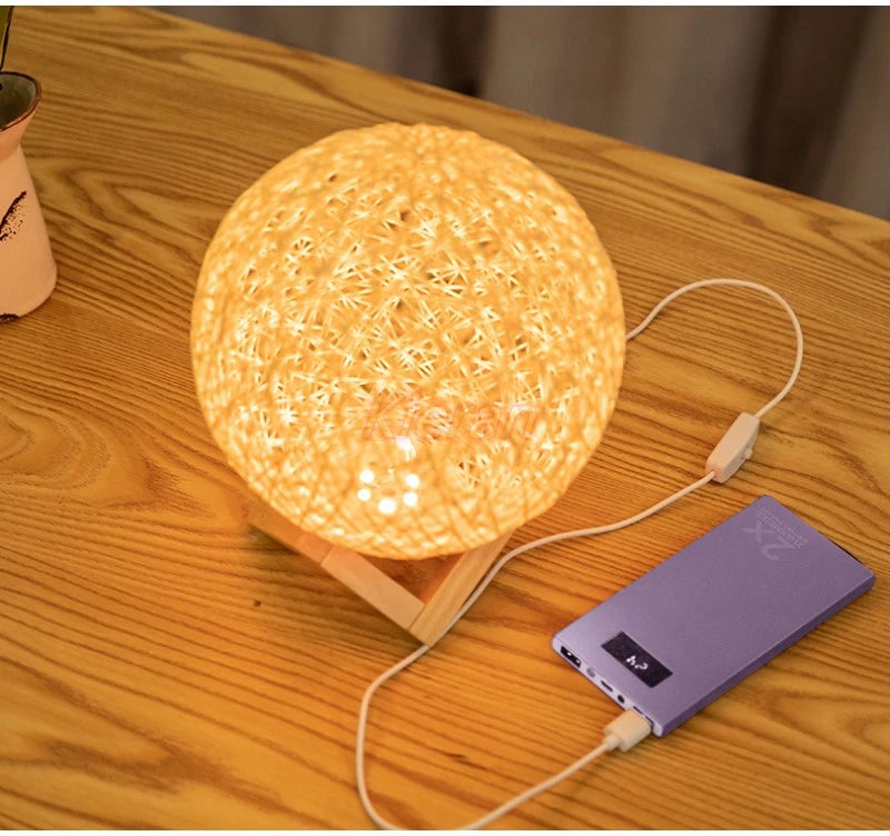 Round lamp with a power bank on a wooden surface
