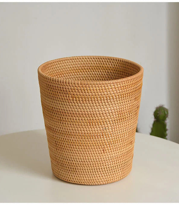 Woven basket on a white surface with a minimal background