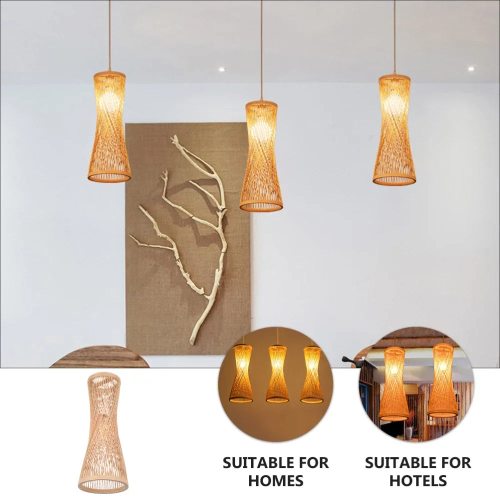 Three woven pendant lights hanging from the ceiling with a neutral wall and branch decor in the background.