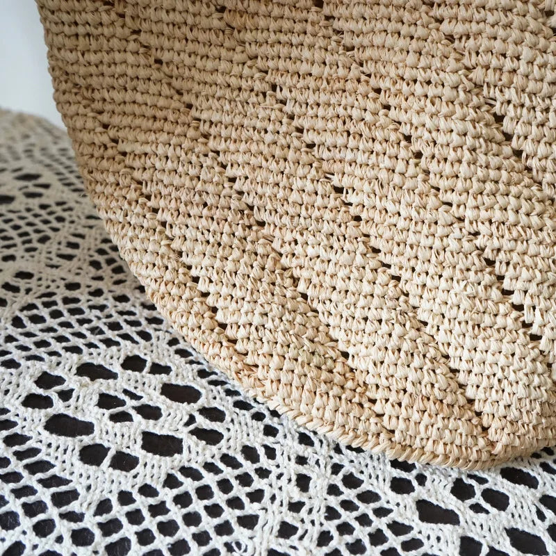 Close-up of a woven basket and textured fabric with black and white pattern