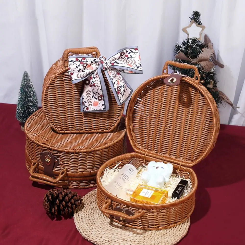 Wicker gift basket with decorative items on a red surface