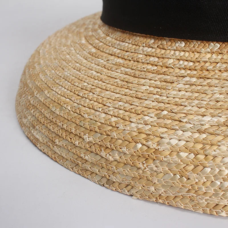 Close-up of a straw hat with a plain background