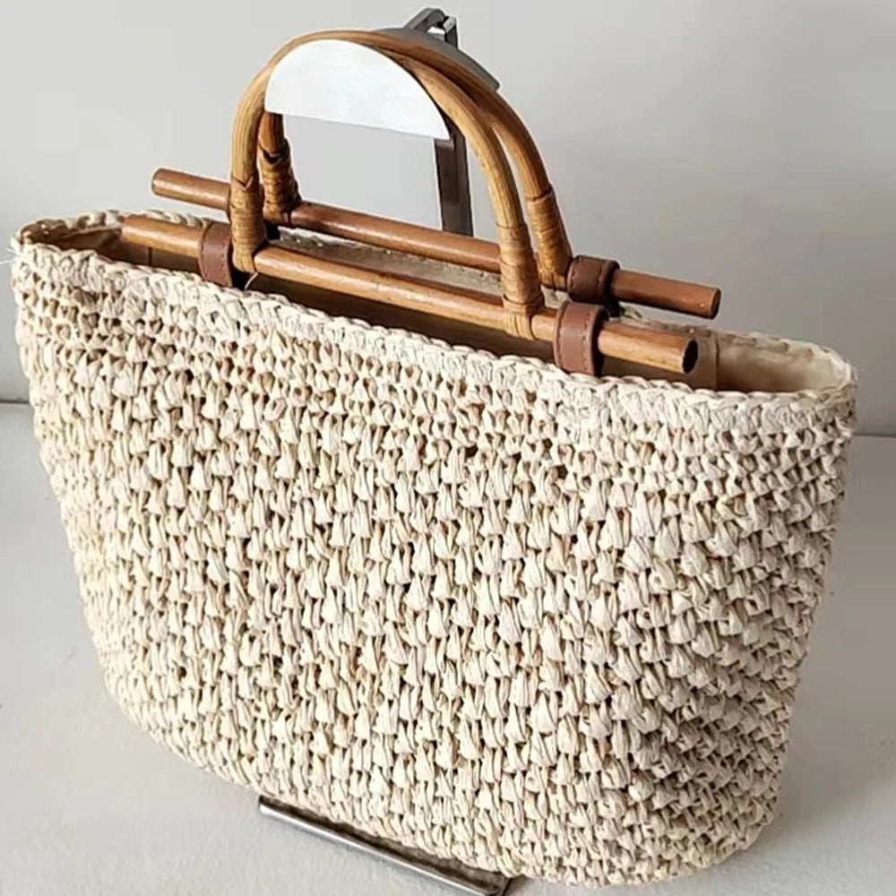 Woven handbag with wooden handles on a light gray background