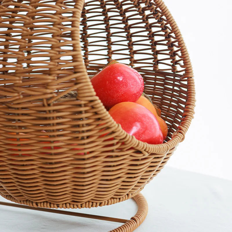 Wicker basket with apples on a white background