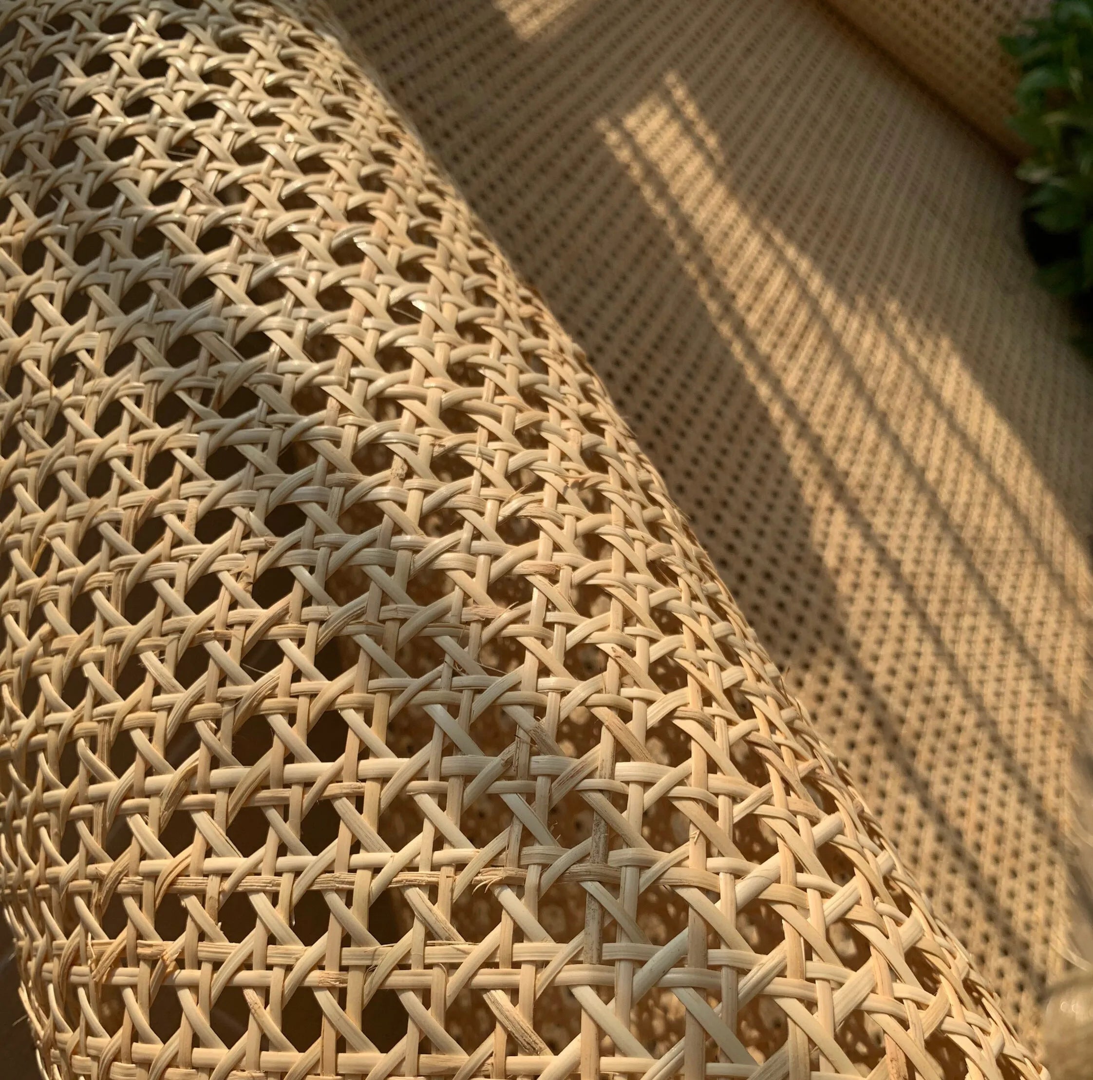 Close-up of rattan woven beige outdoor furniture with a blurred background