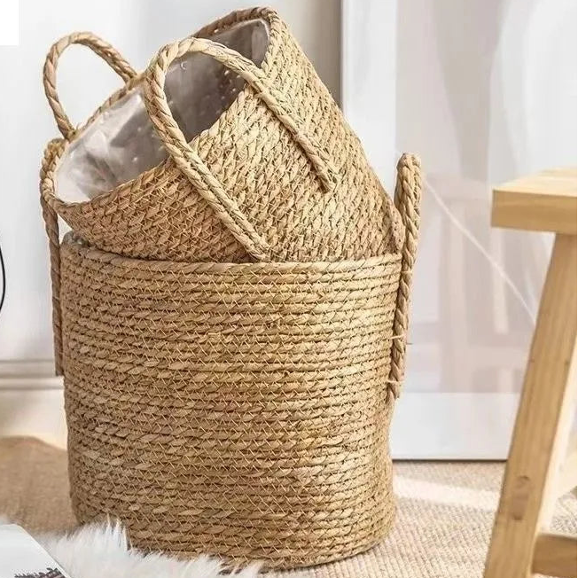 Woven laundry basket with handles on a light background