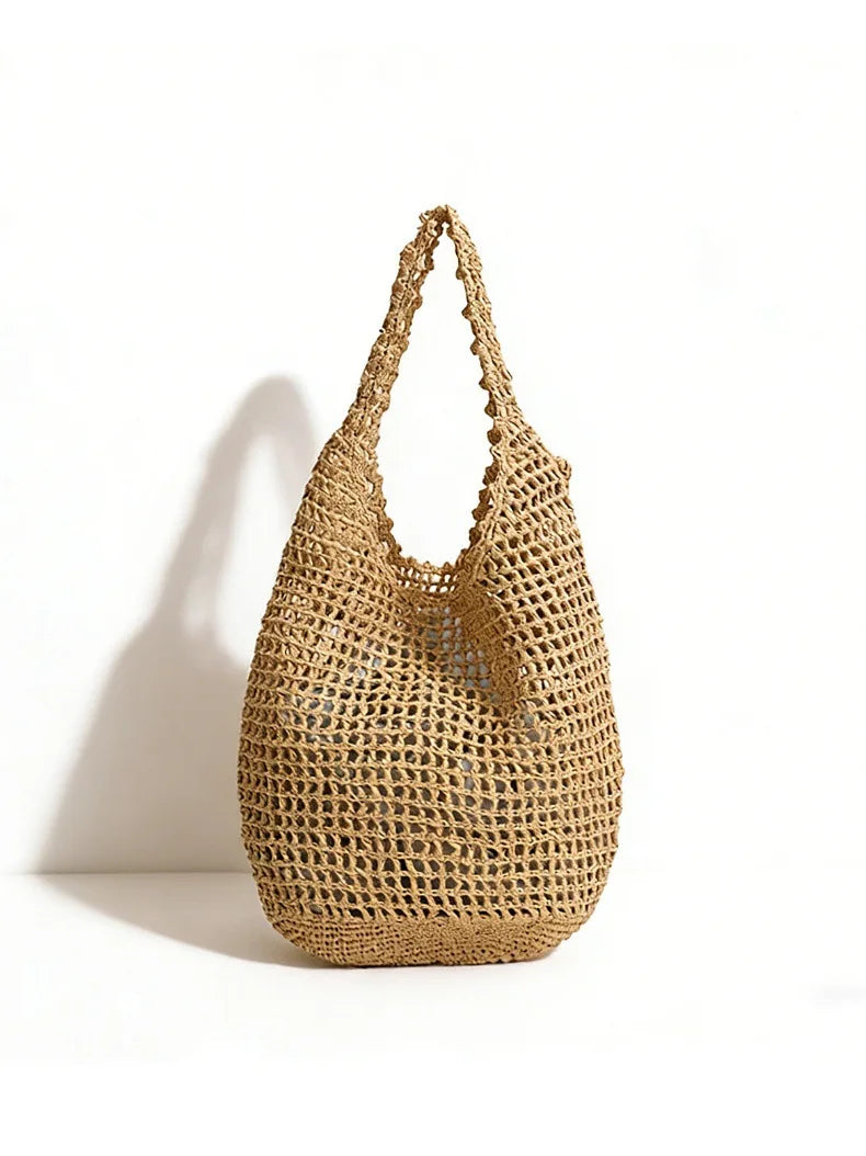 Woven straw bag on a white background