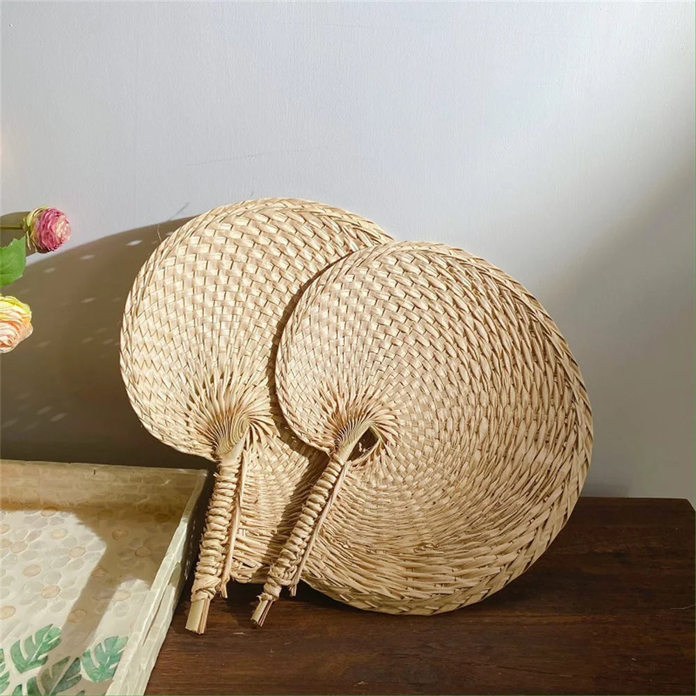 Woven rattan elephant decoration on a wooden surface with a neutral background