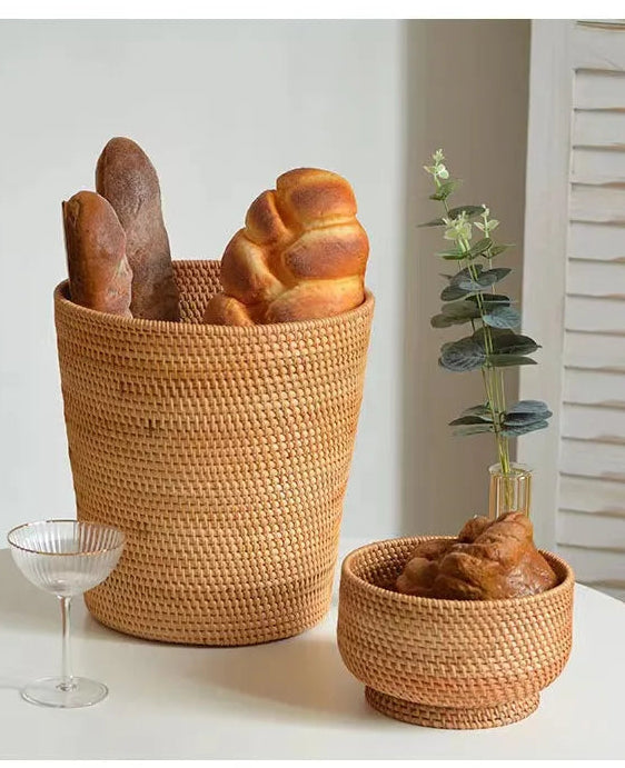 Woven baskets with bread on a white surface, minimal background