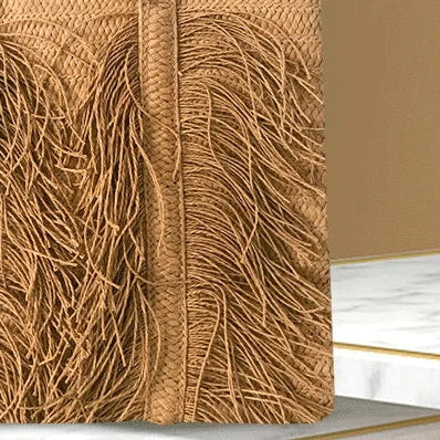 Woven handbag with a visible brand logo on a green and brown gradient background