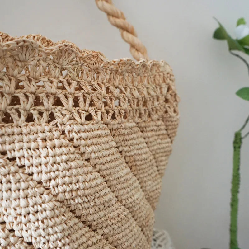 Close-up of a woven basket with a plant in the background