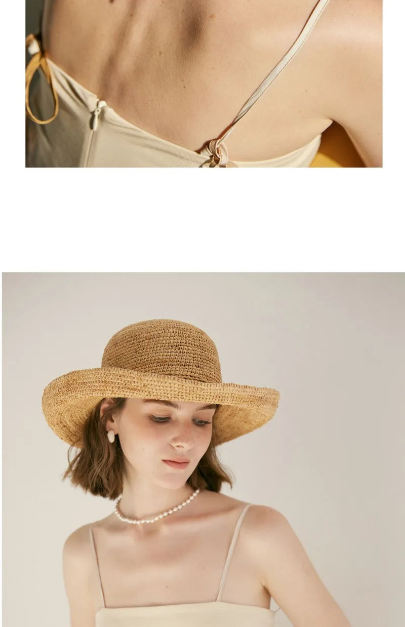 Woman wearing a straw hat and pearl necklace on a plain background
