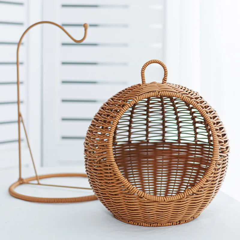Wicker rattan home cage hanging with a hook on a white background