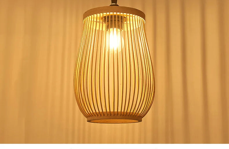 Wooden pendant light with a warm glow against a beige curtain background