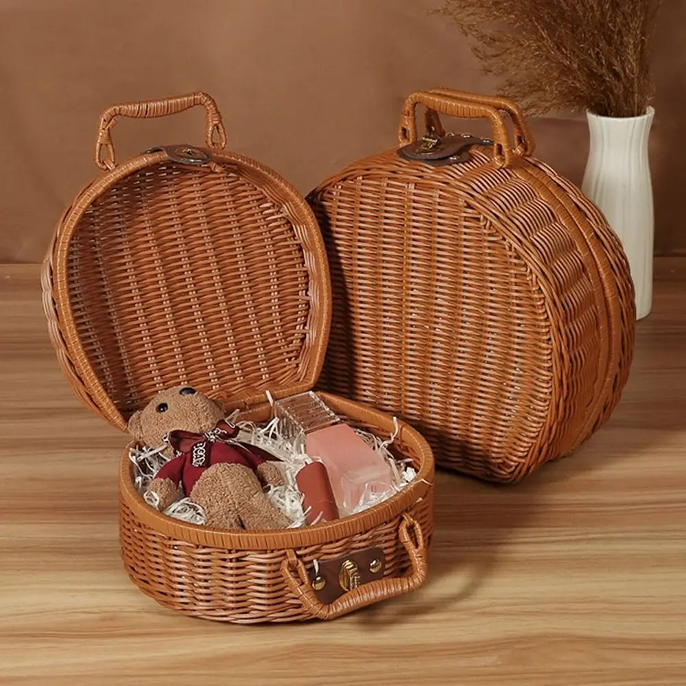 Wicker picnic basket with teddy bear and items on a wooden surface