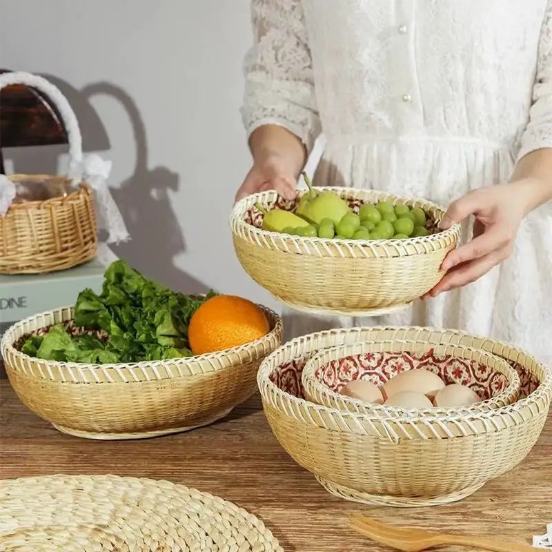 Wicker baskets with fruits and vegetables on a wooden surface