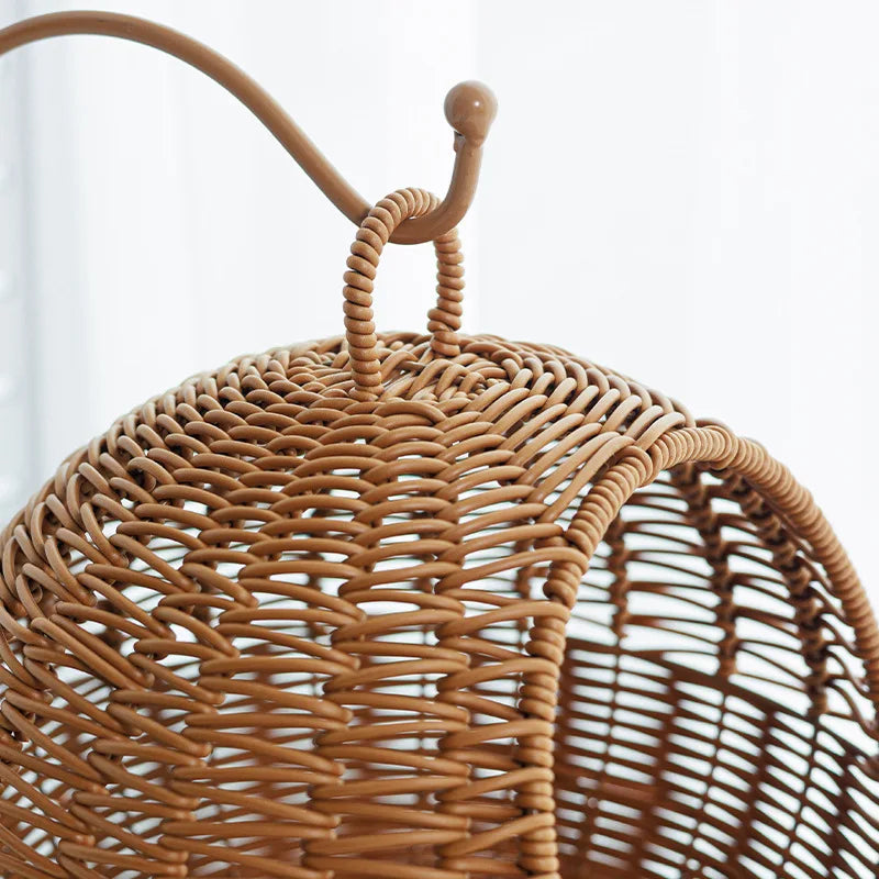 Close-up of a wicker basket with a handle on a white background