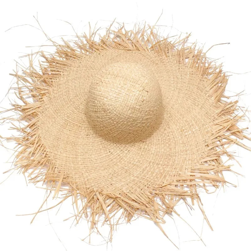 Beige straw hat with wide brim on a white background
