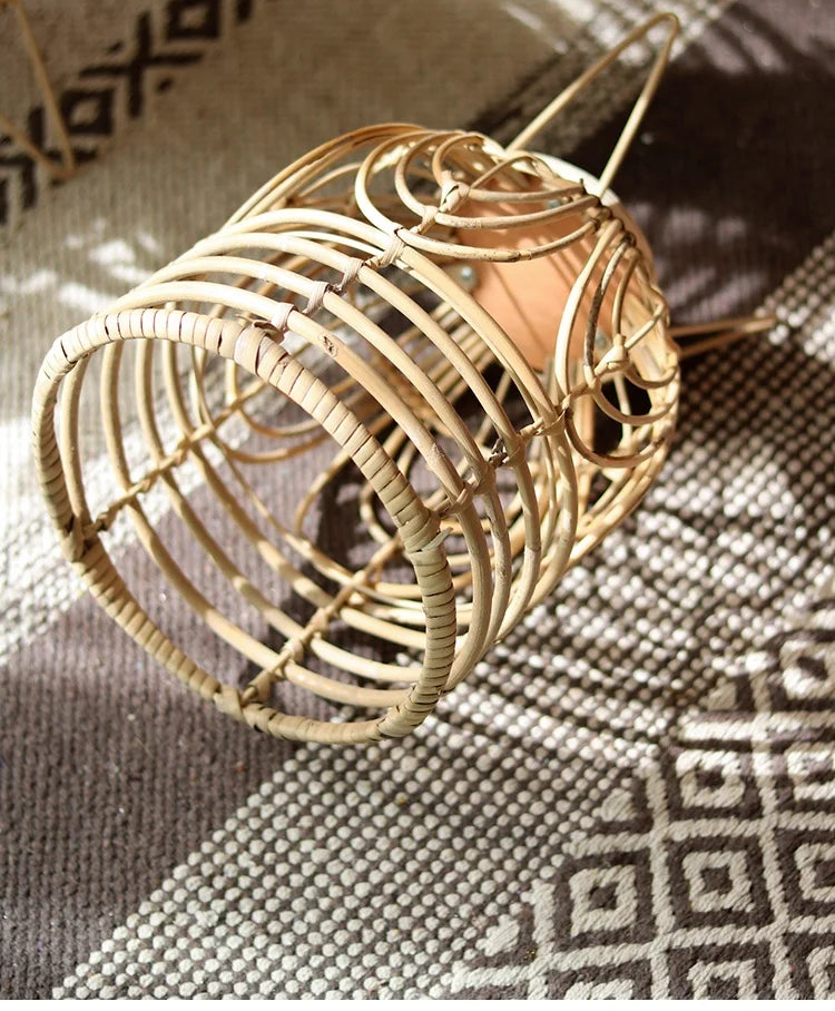 Decorative rattan lantern on a textured surface with 'YUANJIE HOME' branding.