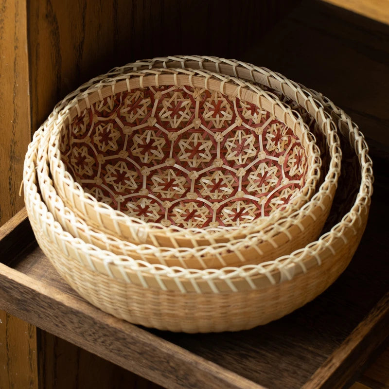 Woven baskets with a geometric pattern on a wooden shelf