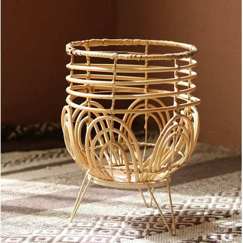 Woven rattan candle holder on a textured surface with a warm background
