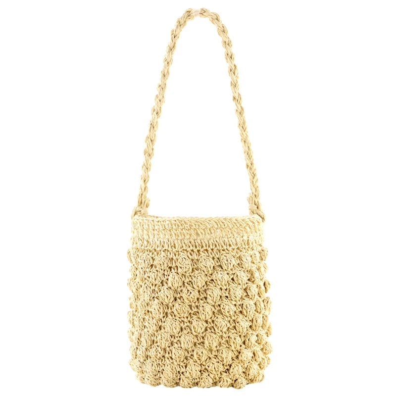 Beige woven handbag on a white background